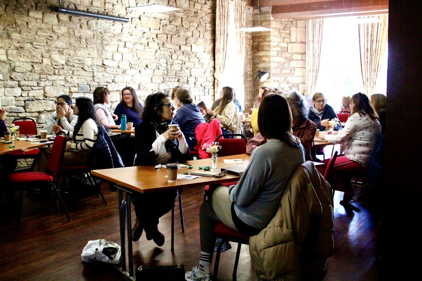 Attendees seated for the Self Mastery Network event at Epiphany House