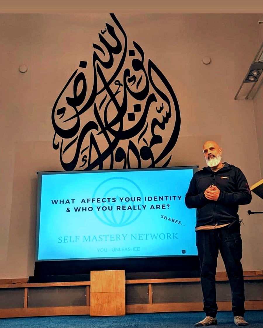 Mubeen Azam addressing the room at a Time for Change session in Birmingham